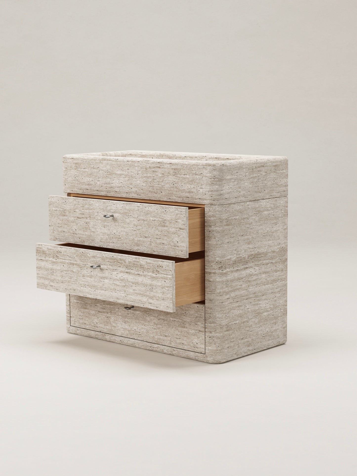 Travertine stone bathroom vanity with open drawers showing storage and natural wood interior