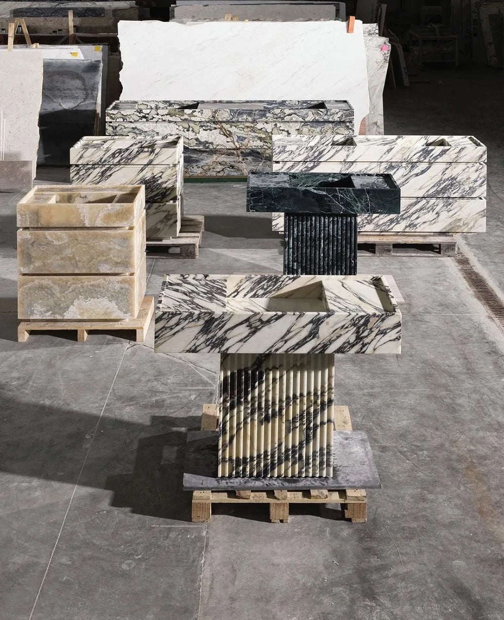 Florence marble vanity in production workshop showing natural stone slabs and handcrafted pieces