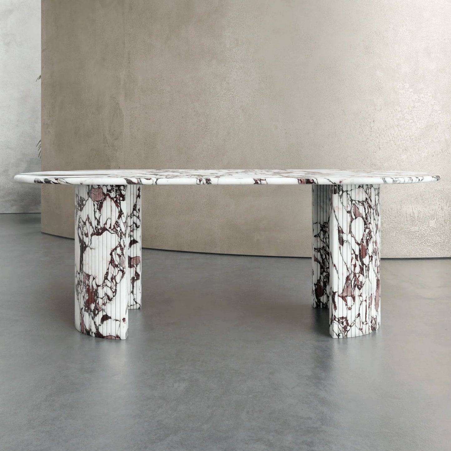 Front view of Anzio Calacatta Viola marble dining table with red and white natural stone veining