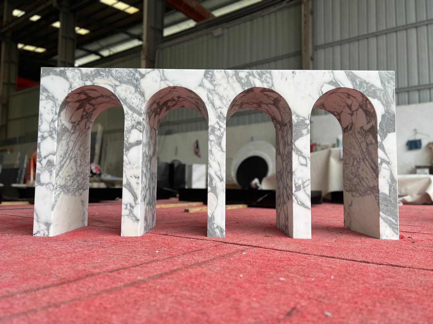 Arca console table in Arabescato marble during production