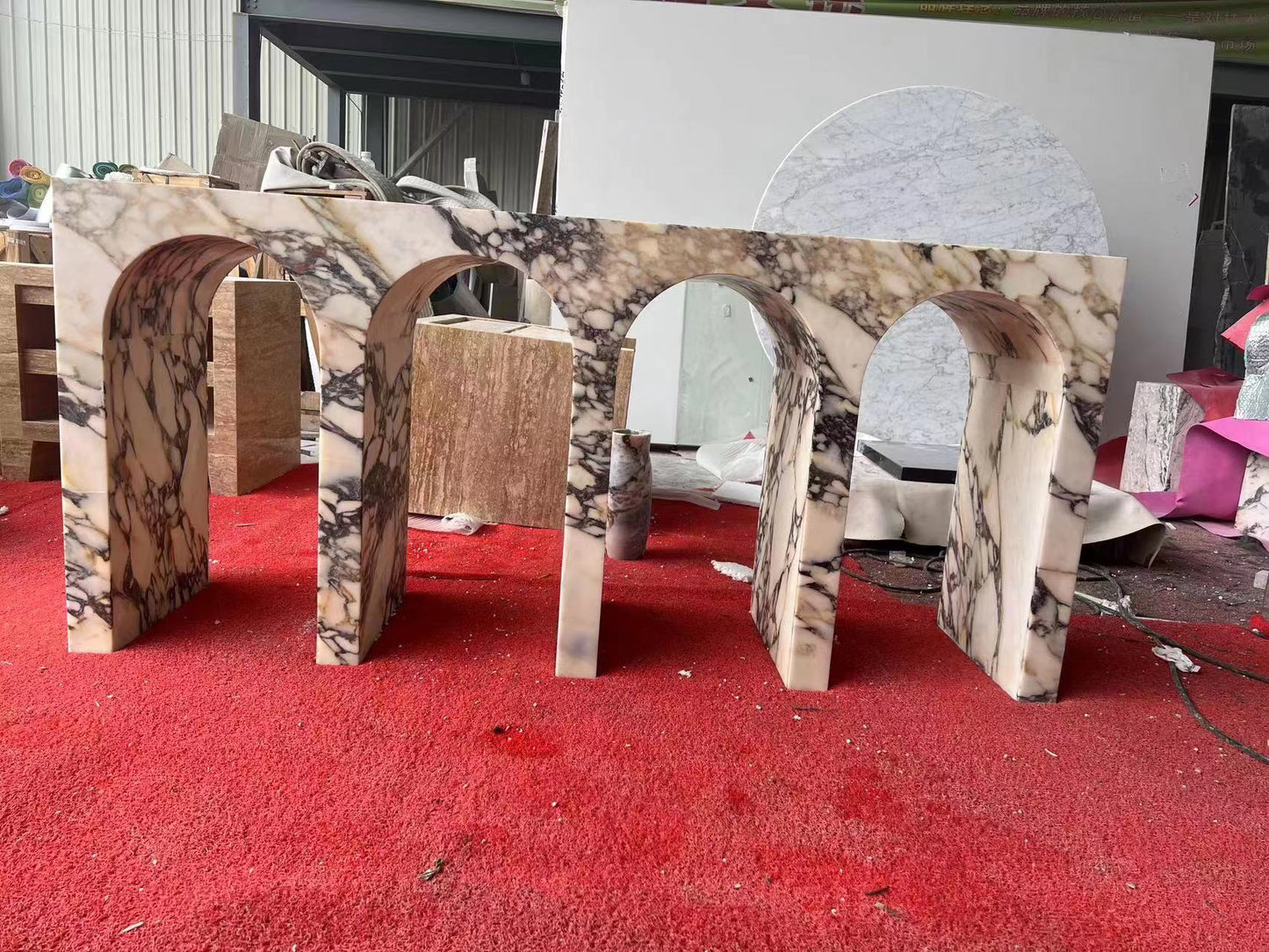 Arca console table in Calacatta marble during fabrication