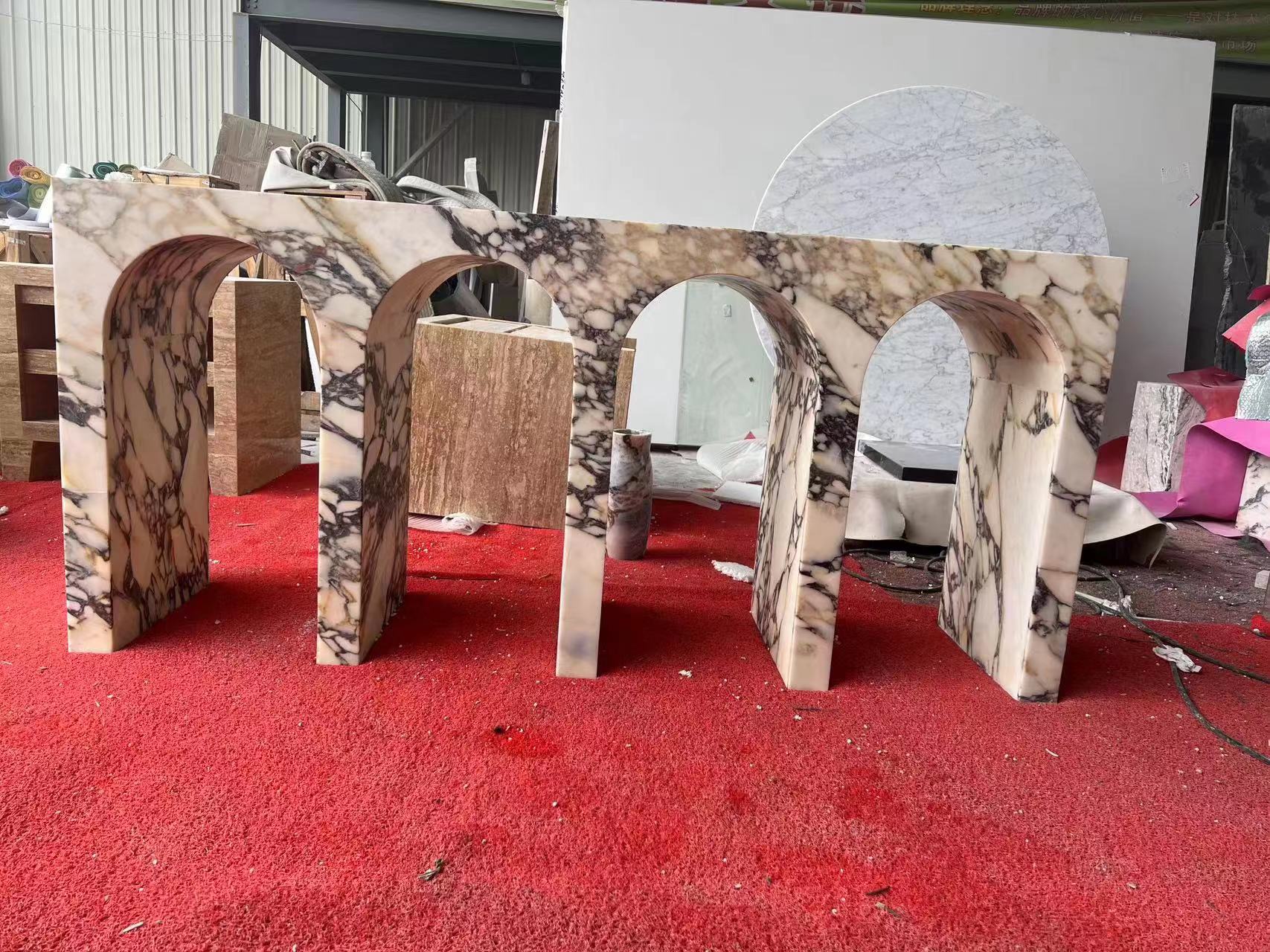 Arca console table in Calacatta marble during fabrication