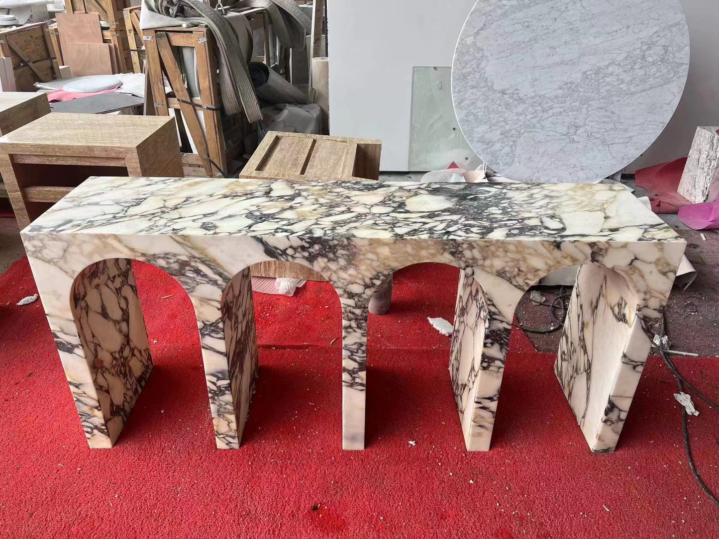 Arca console table in Calacatta Viola marble during stone fabrication