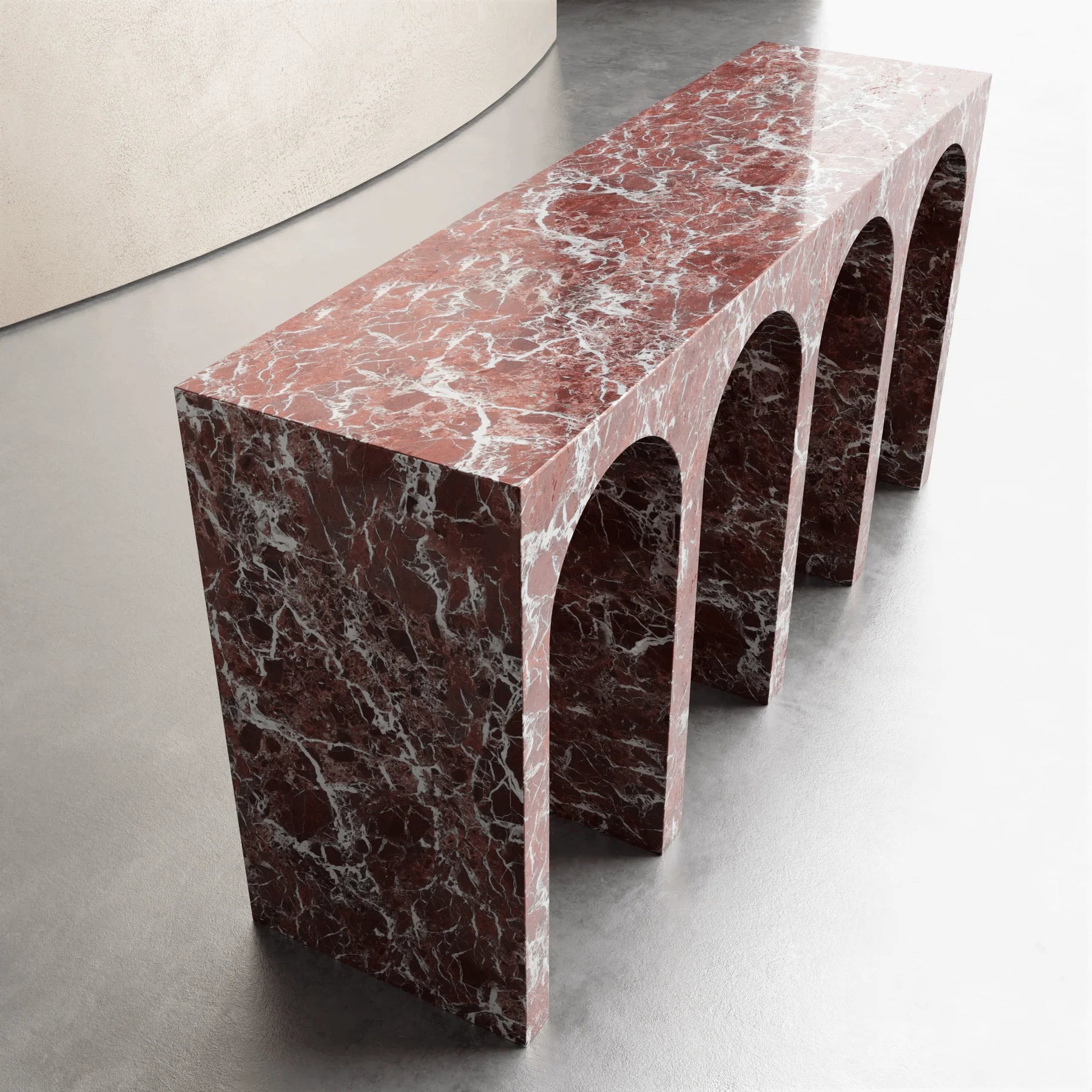 Arca console table in Rosso Levanto marble with sculptural arches