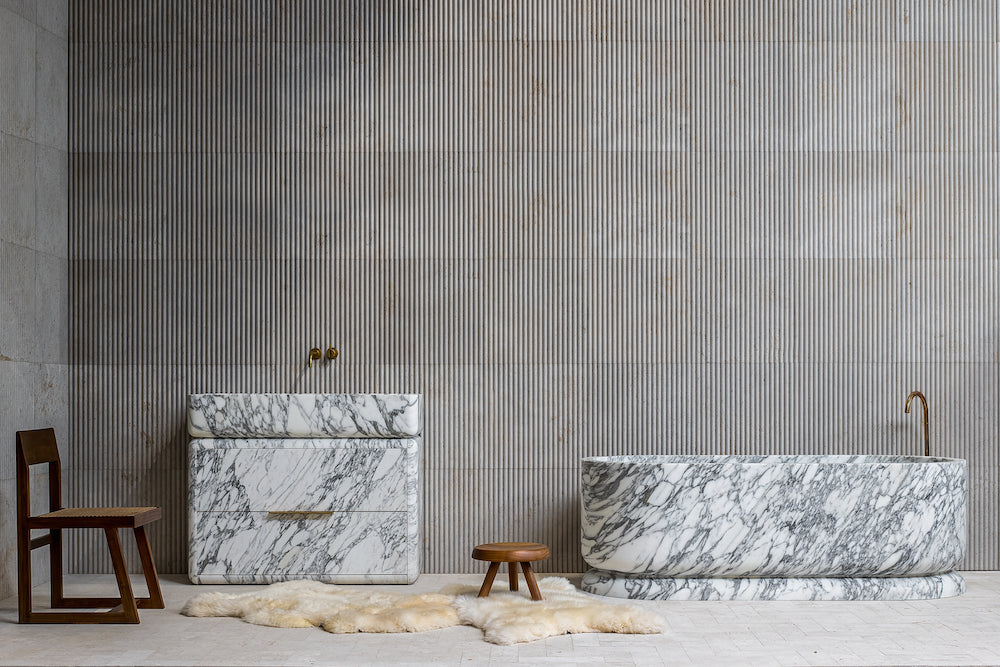 Luxury marble bathroom vanity and bathtub in a refined architectural interior setting