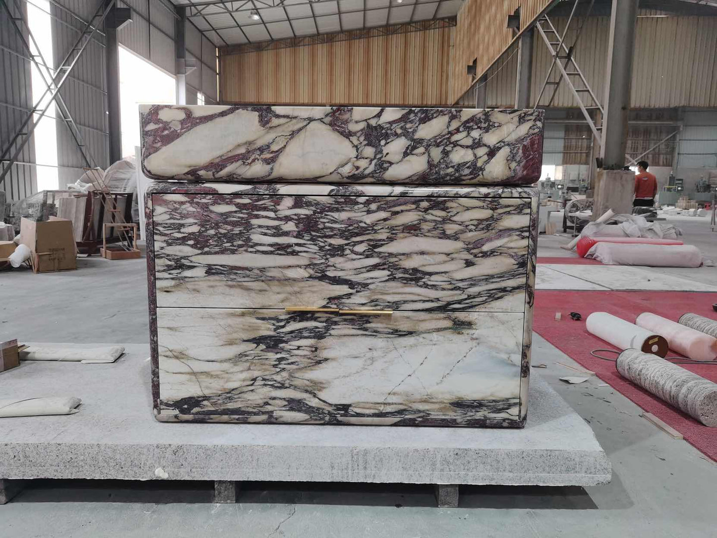 Handcrafted marble vanity in production workshop showing natural stone craftsmanship
