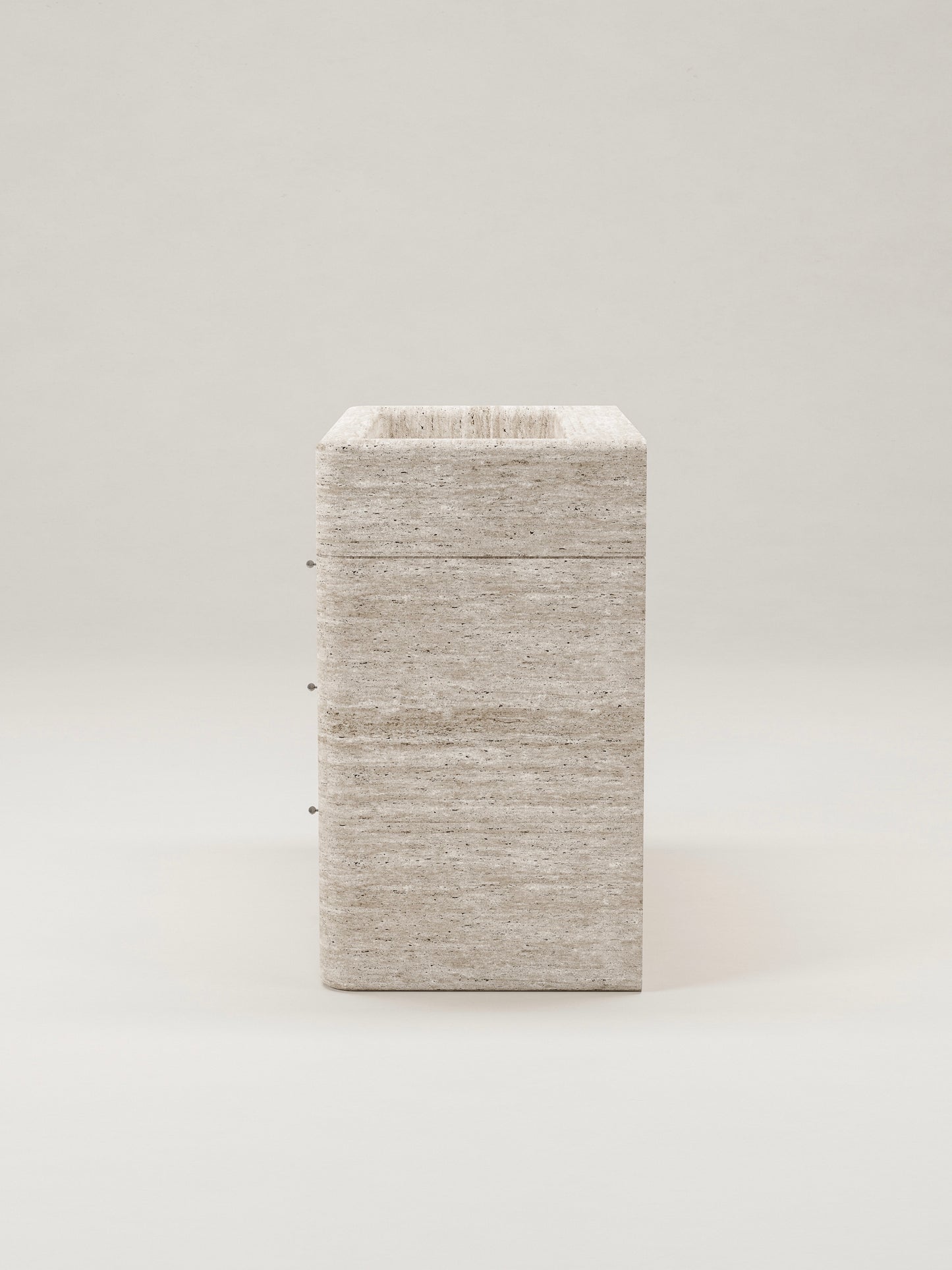 Travertine stone bathroom vanity side view showing depth and minimalist design