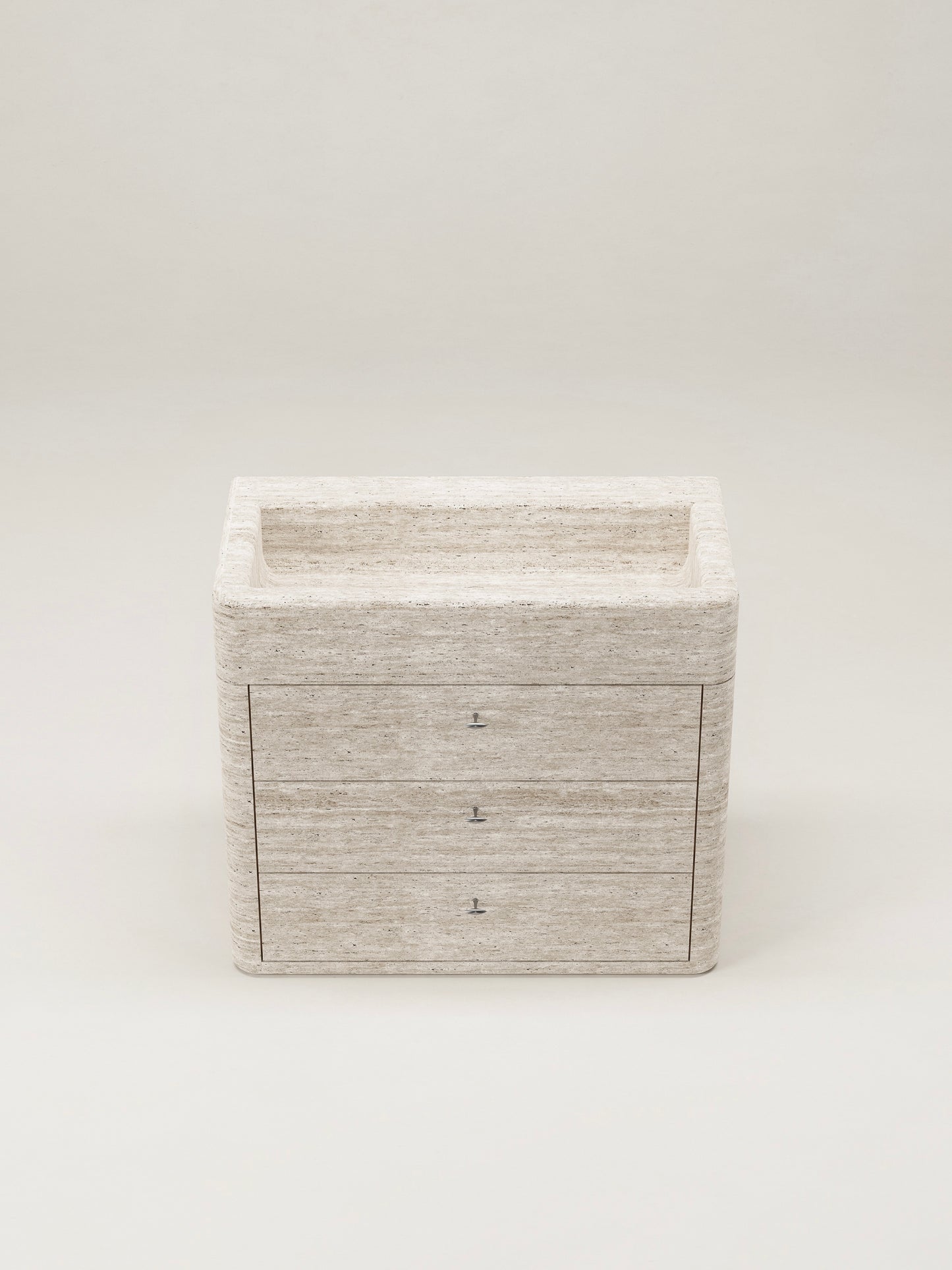 Travertine stone bathroom vanity with drawers and integrated sink on white background