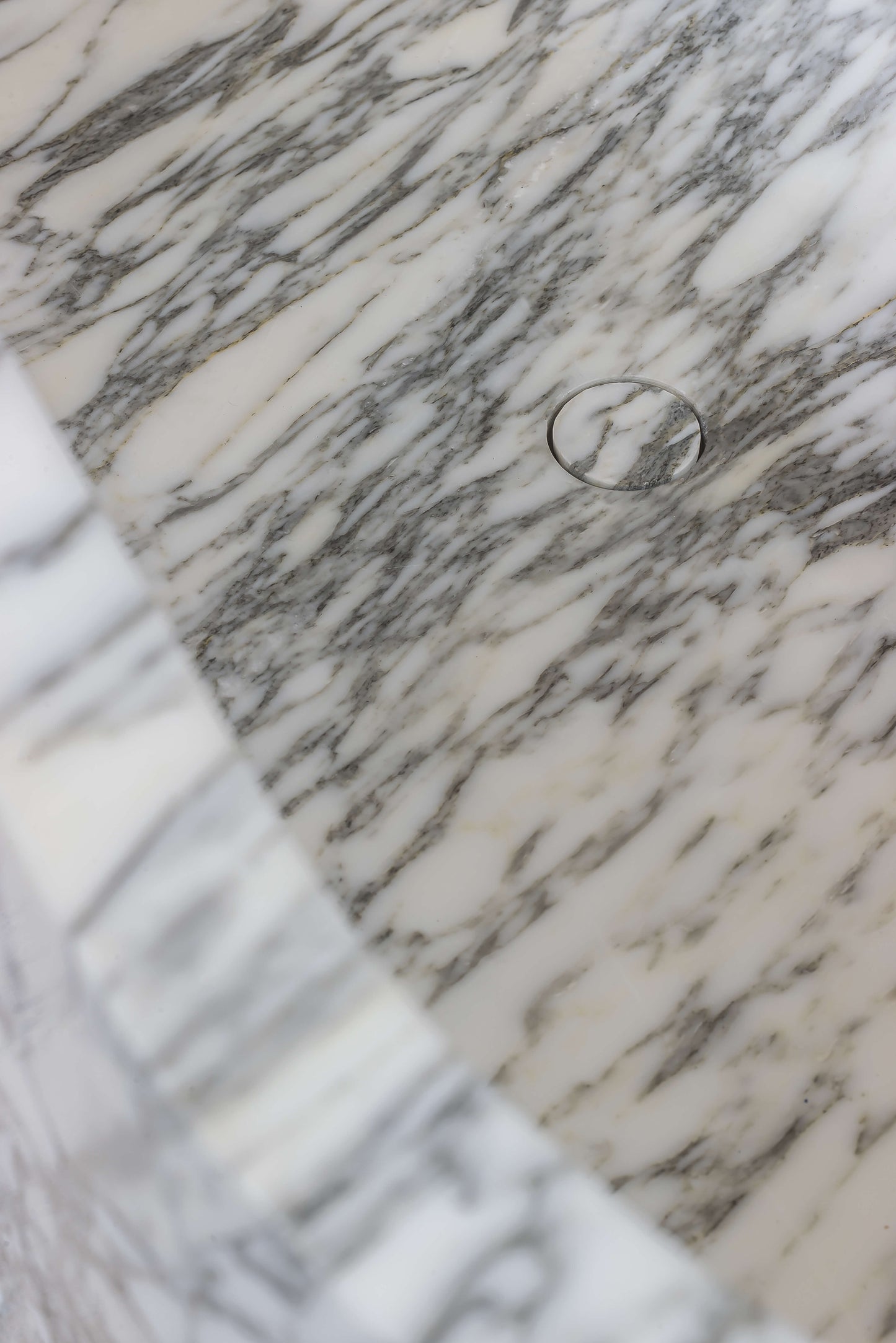 Calacatta marble bathtub detail with natural grey veining by Eden Stone Designs