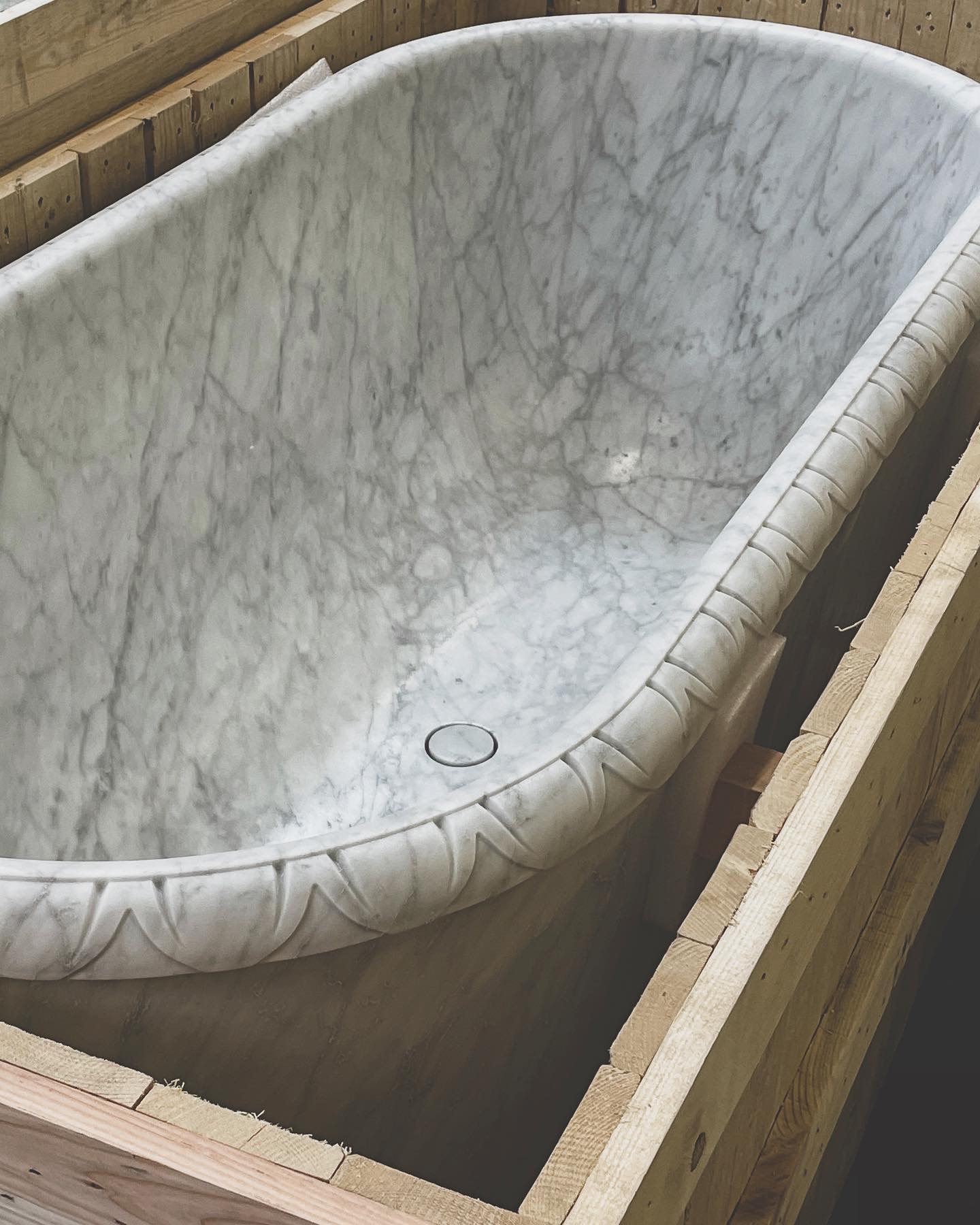 Calacatta marble freestanding bathtub packed in wooden crate by Eden Stone Designs