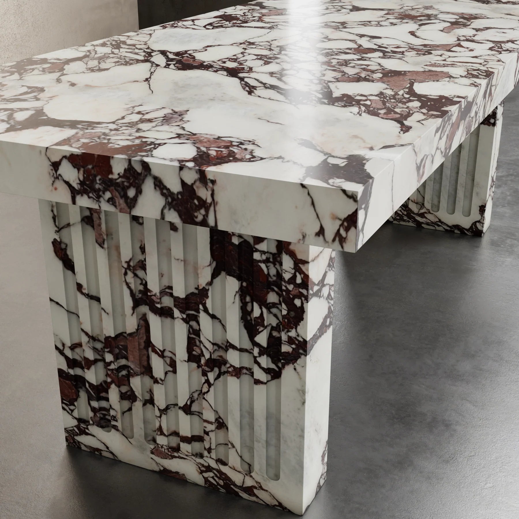 Siena marble dining table detail by Eden Stone Designs luxury natural marble dining table with fluted sculptural base and dramatic red veining