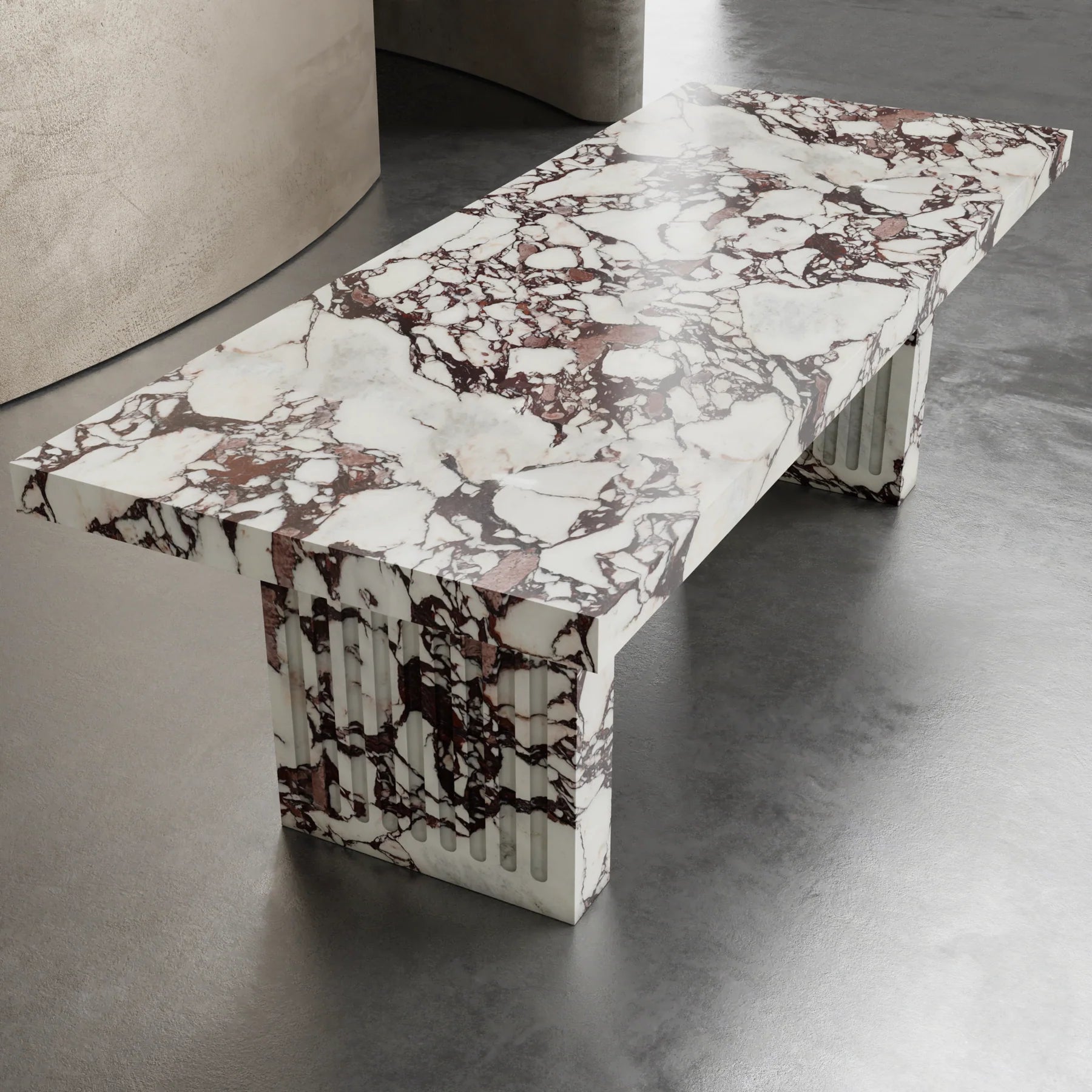 Siena marble dining table by Eden Stone Designs luxury marble dining table with sculptural fluted base and dramatic natural veining