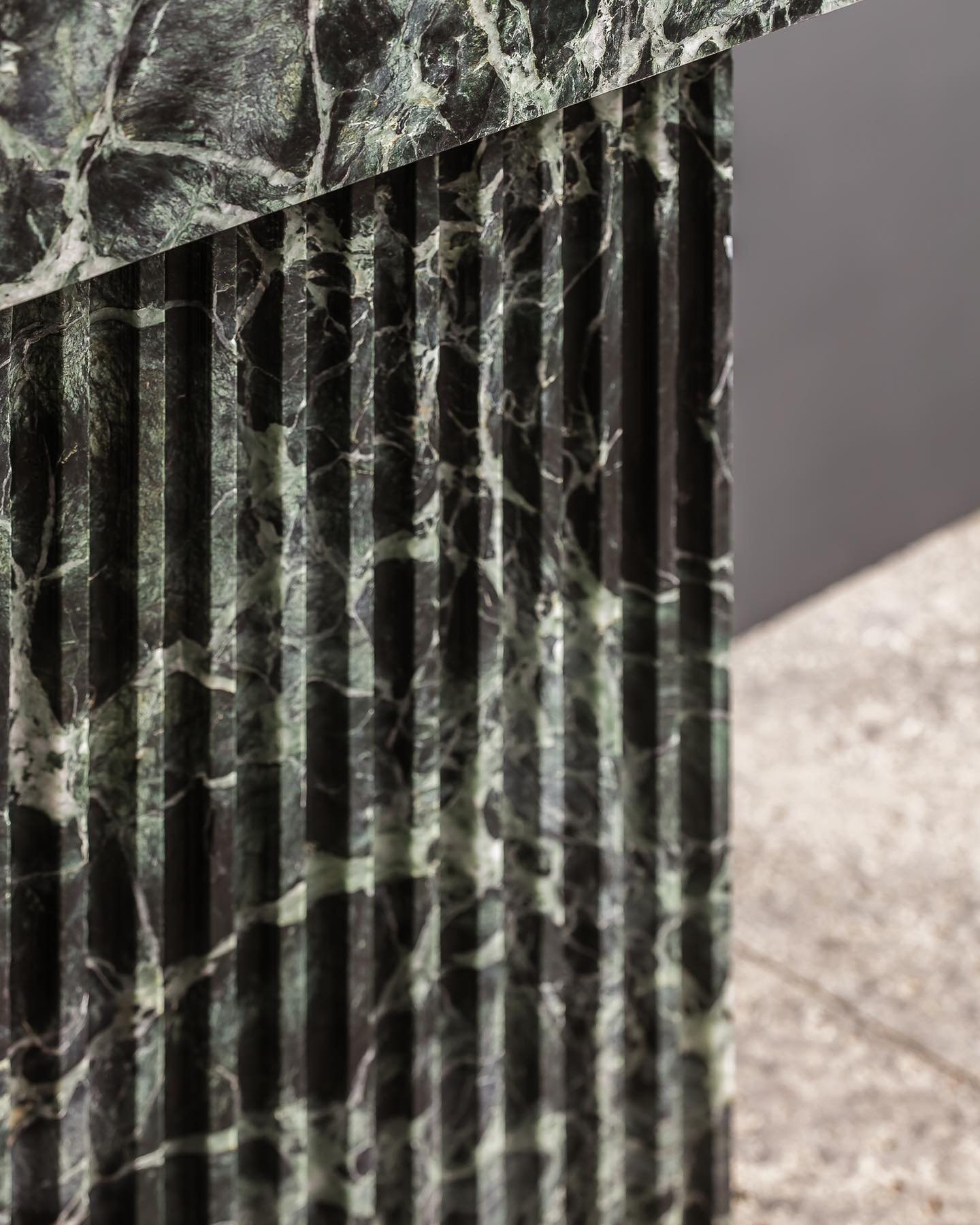 Florence marble vanity fluted base detail in green natural stone showing handcrafted vertical grooves
