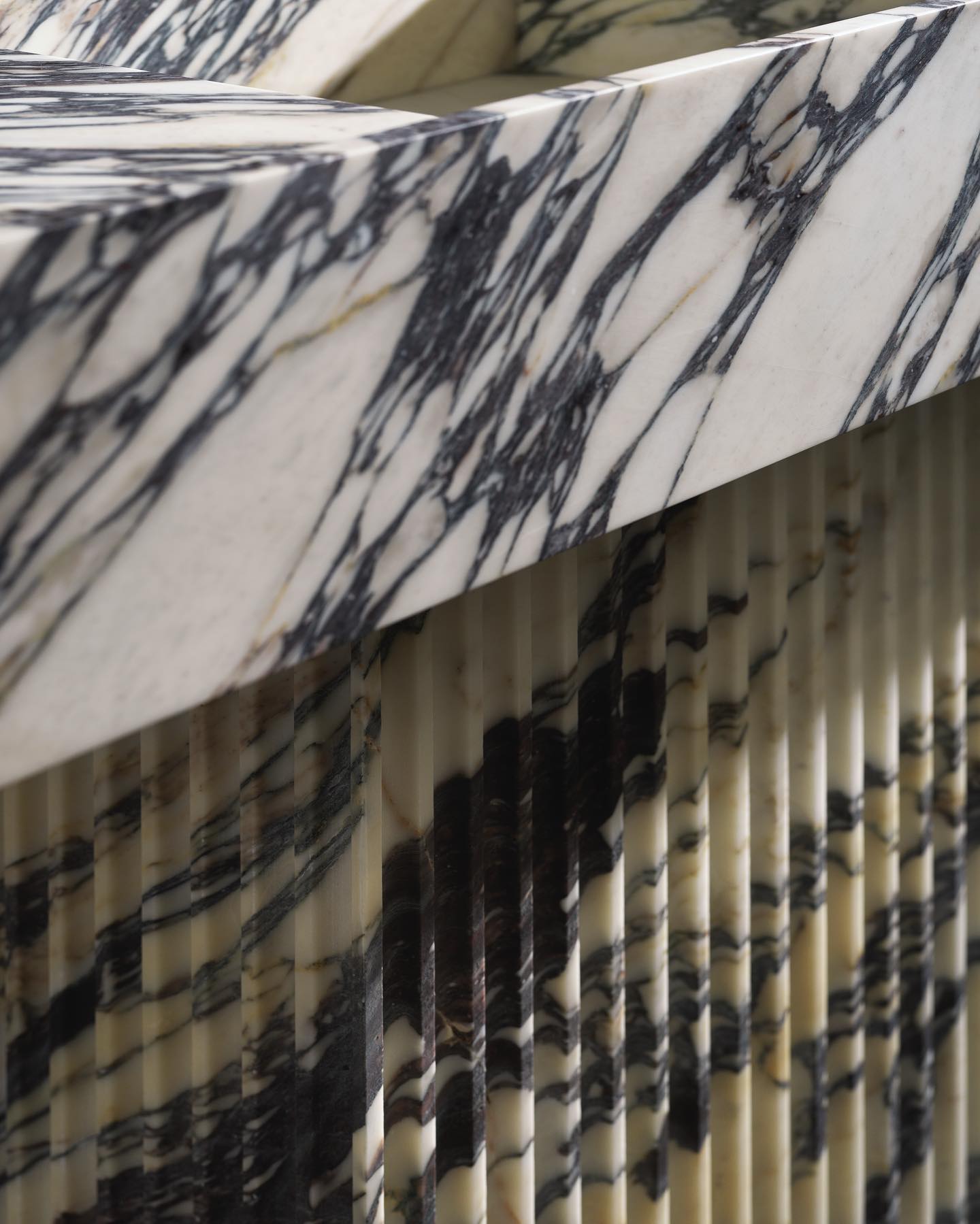 Florence marble vanity fluted base detail with vertical stone texture and natural veining