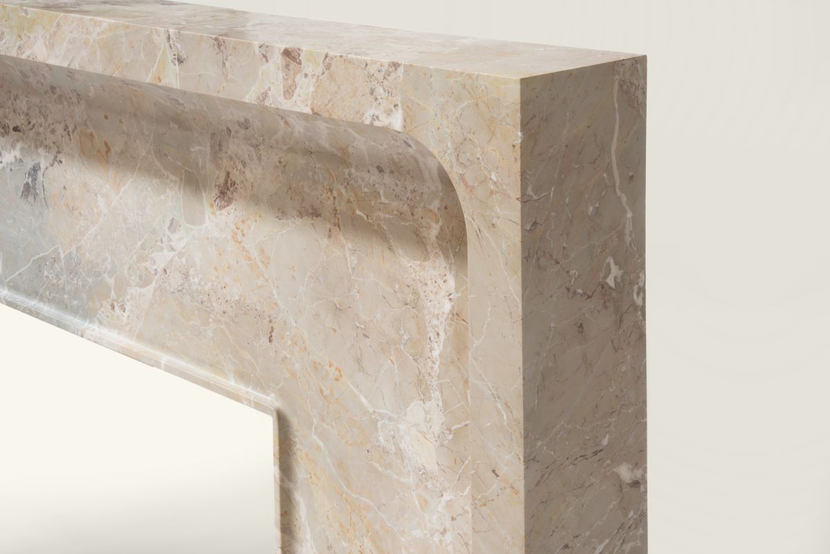 Sculptural marble edge detail of Giacomo fireplace by Eden Stone Designs