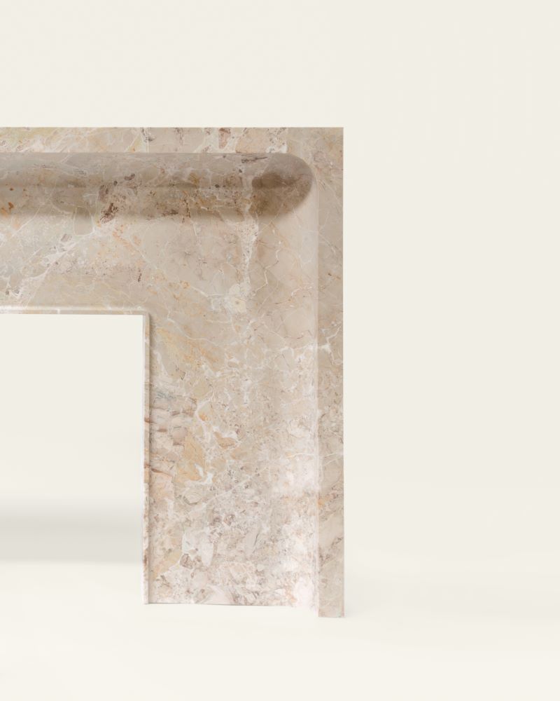 Carved marble corner detail of Giacomo fireplace by Eden Stone Designs