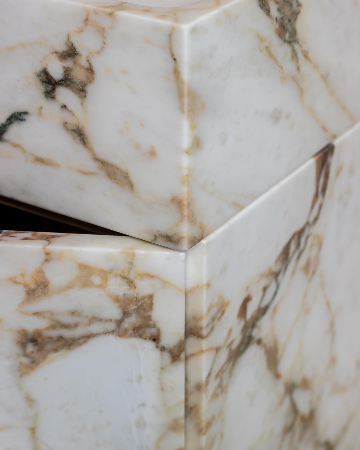 Calacatta Viola marble vanity corner detail showing precision edges and natural stone veining