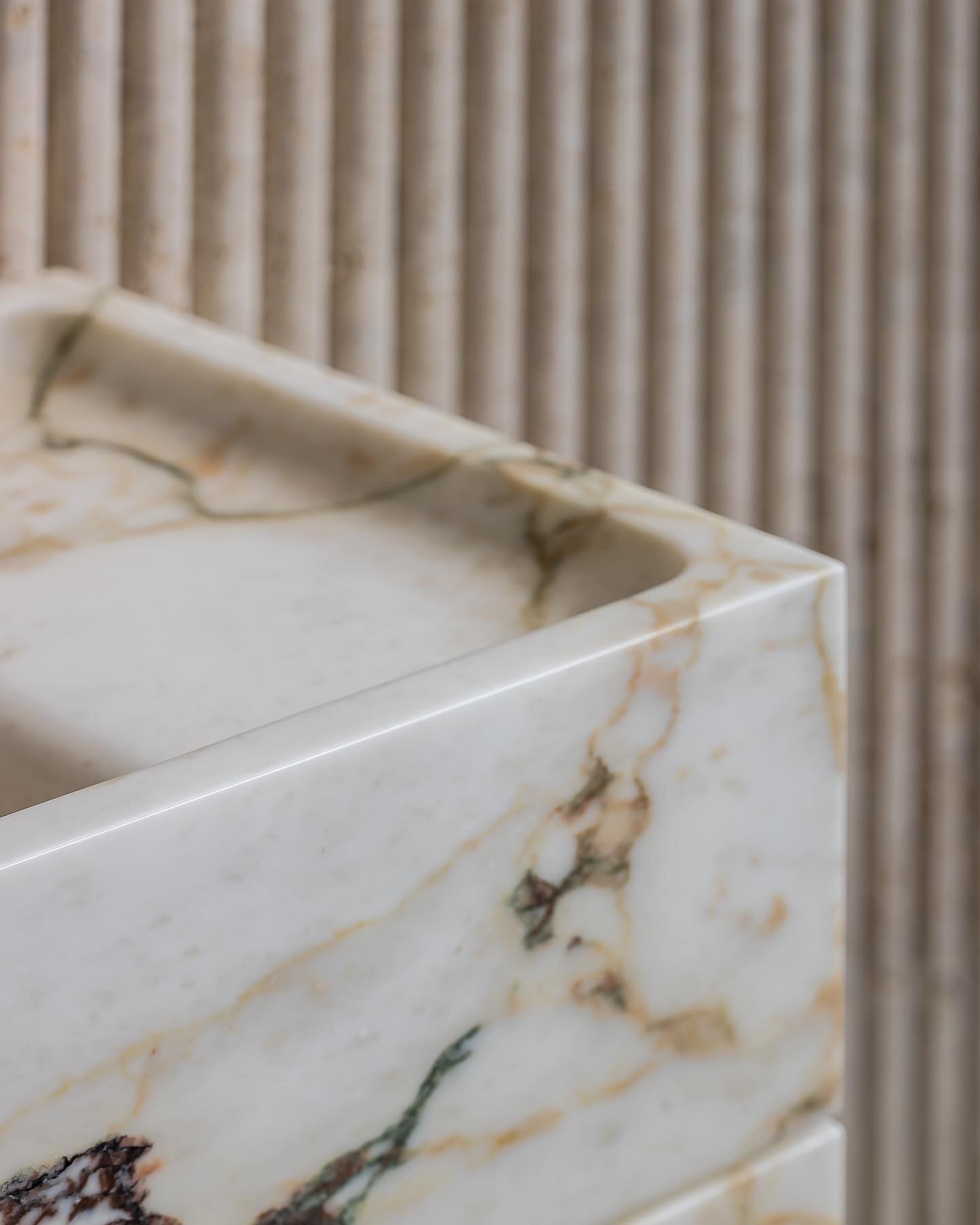 Calacatta Viola marble vanity top detail showing refined edge and natural stone veining