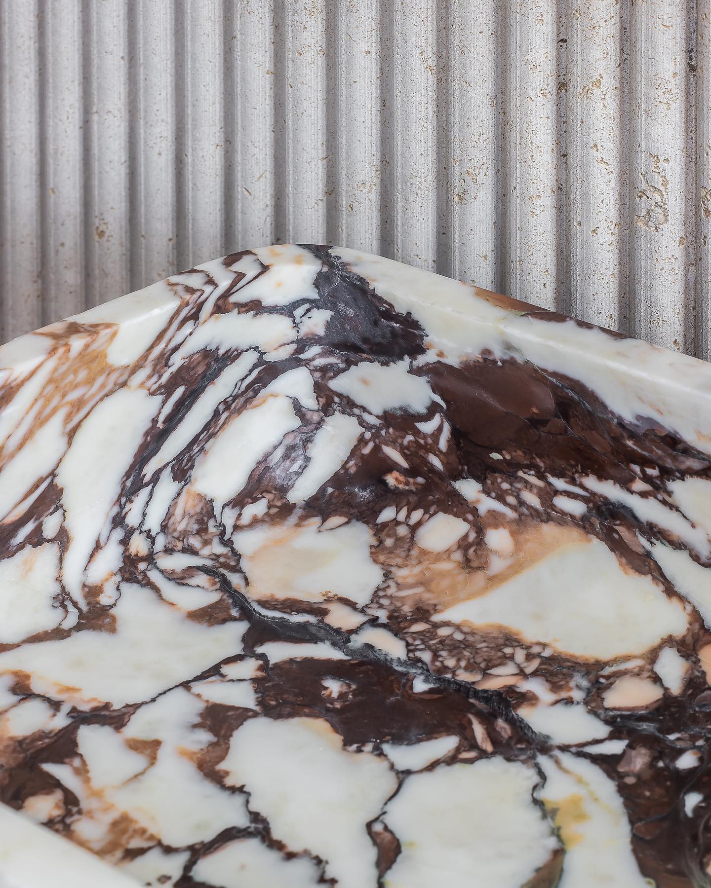 Calacatta Viola marble vanity detail with bold veining and natural stone composition