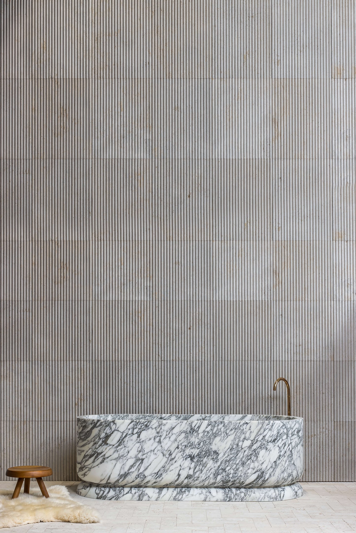 Luxury Calacatta marble freestanding bathtub in designer bathroom by Eden Stone Designs