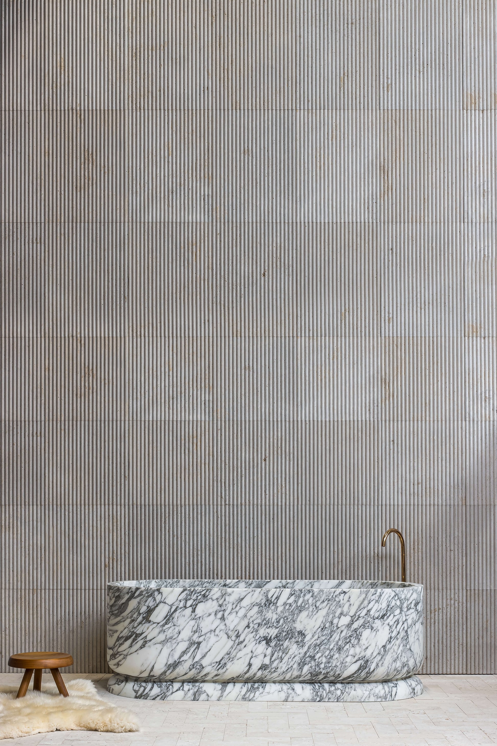 Luxury Calacatta marble freestanding bathtub in designer bathroom by Eden Stone Designs