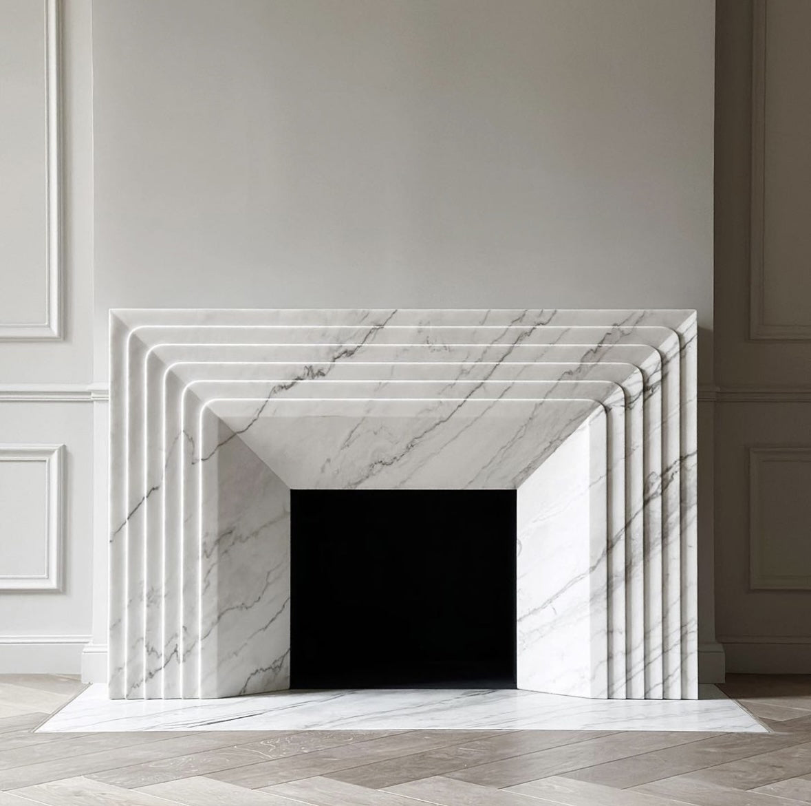 Verona marble fireplace surround in Carrara marble
