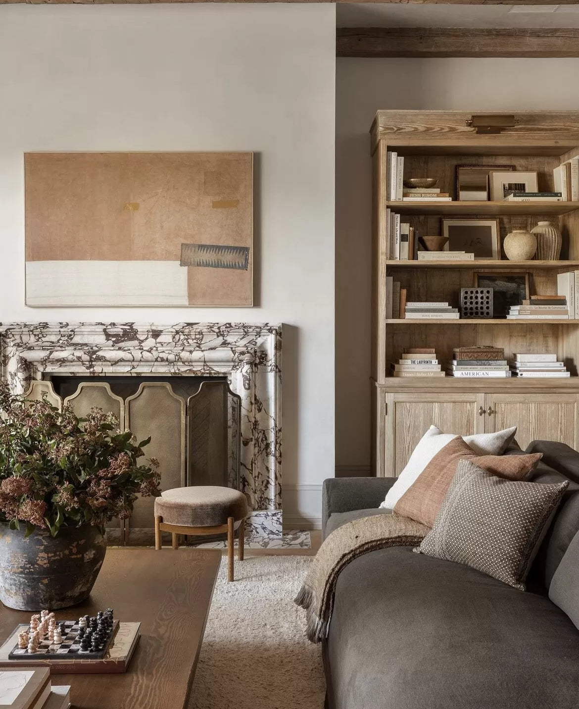 Milan Bolection Breccia Viola marble fireplace in luxury living room by Eden Stone Designs