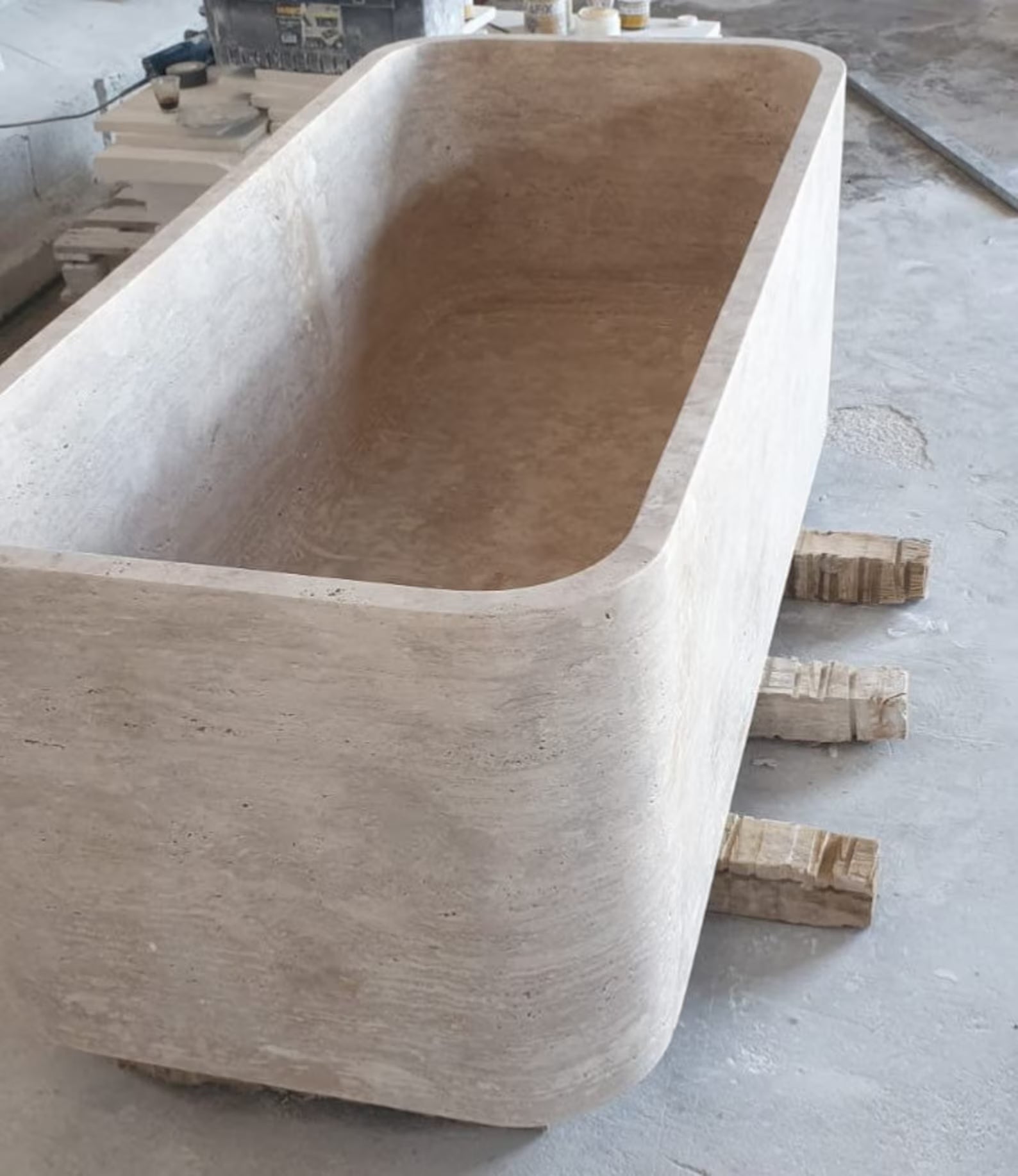 Mirlo travertine freestanding stone bathtub carved from a single block of natural travertine
