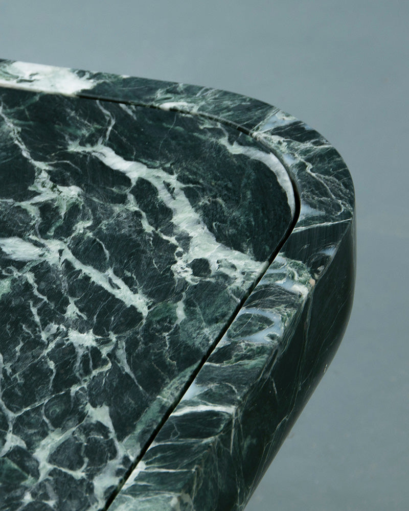 Detail of Novara green marble coffee table showing natural veining by Eden Stone Designs