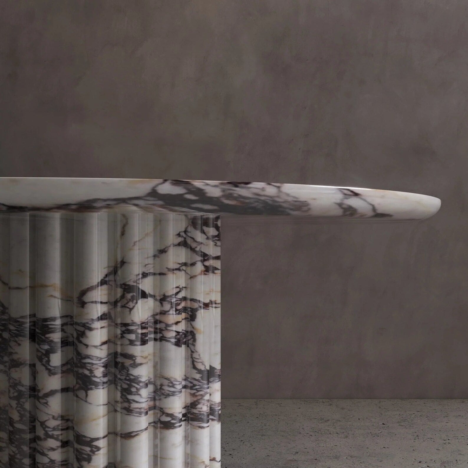 Detail of Palermo round veined marble dining table with sculptural fluted marble pedestal base by Eden Stone Designs