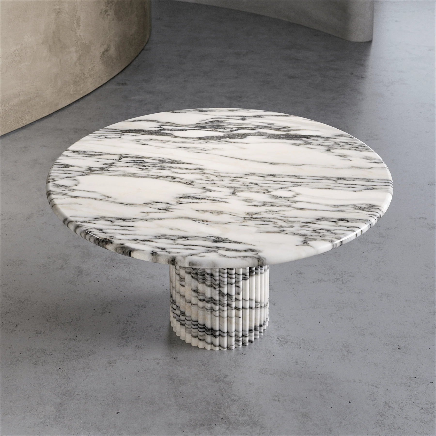 Top view of Palermo round white marble dining table with natural Calacatta marble surface by Eden Stone Designs