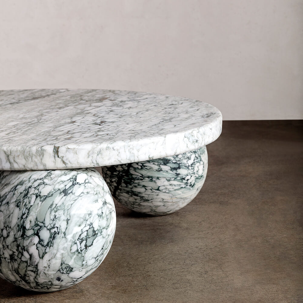 Detail of Piccolo Arabescato marble coffee table with sculptural sphere base
