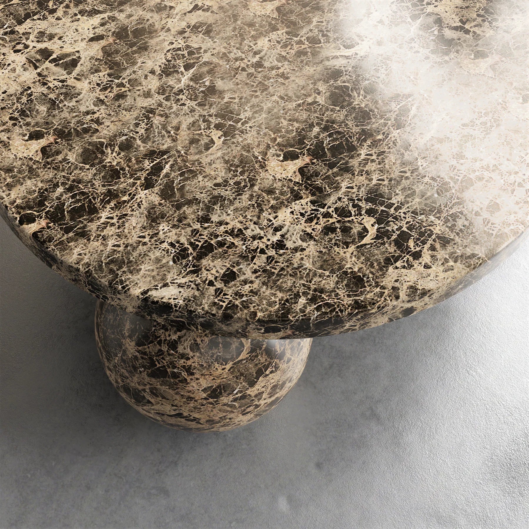 Detail of Dark Emperador marble Piccolo coffee table with sculptural sphere base