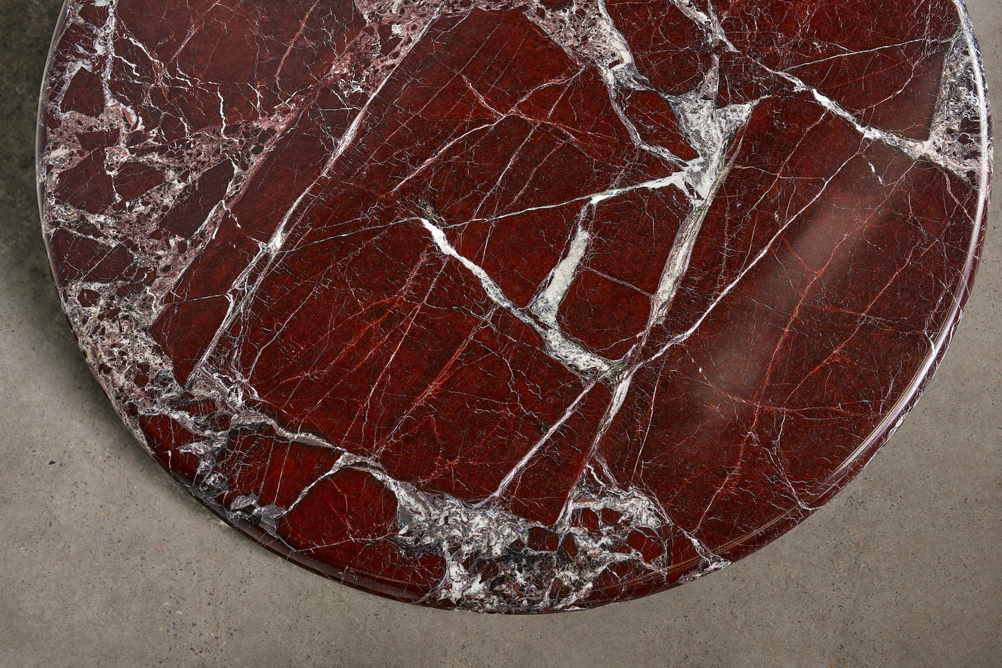 Detail of Rosso Levanto marble top on Piccolo sculptural coffee table