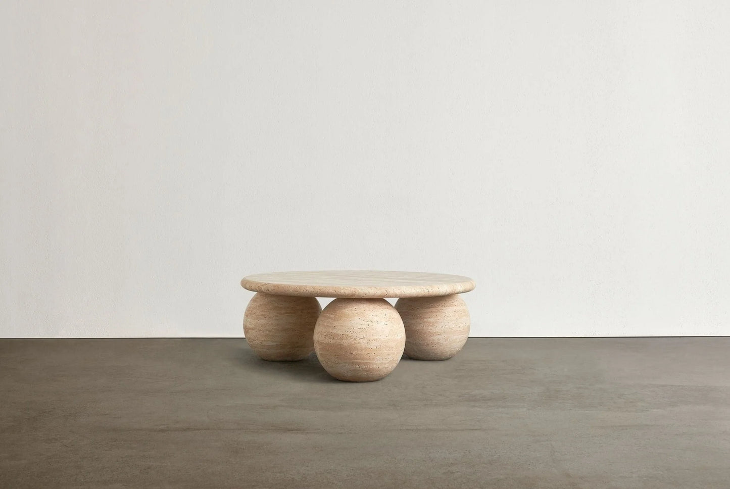 Piccolo travertine coffee table with sculptural sphere base