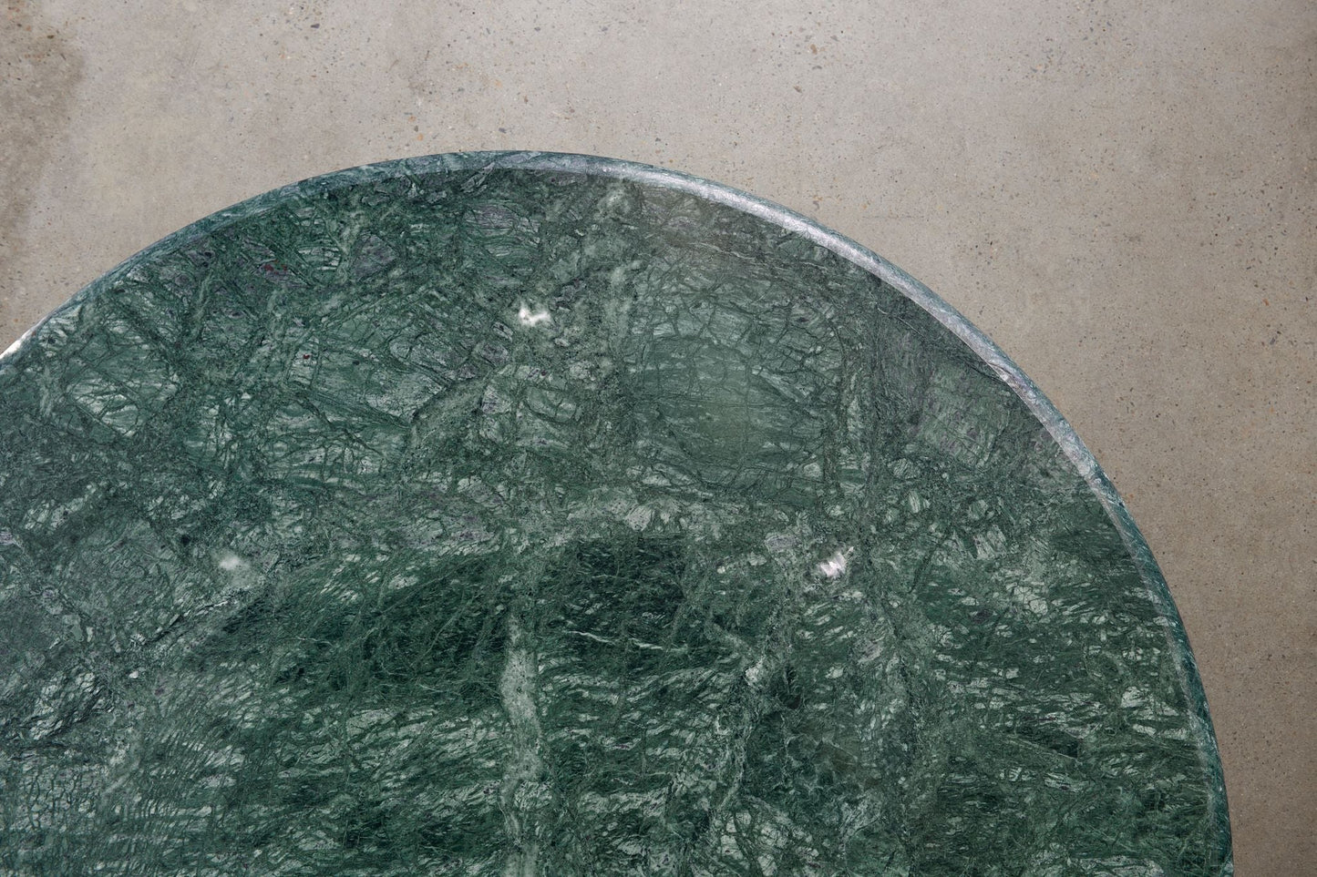 Verde Alpi marble top detail on Piccolo sculptural coffee table