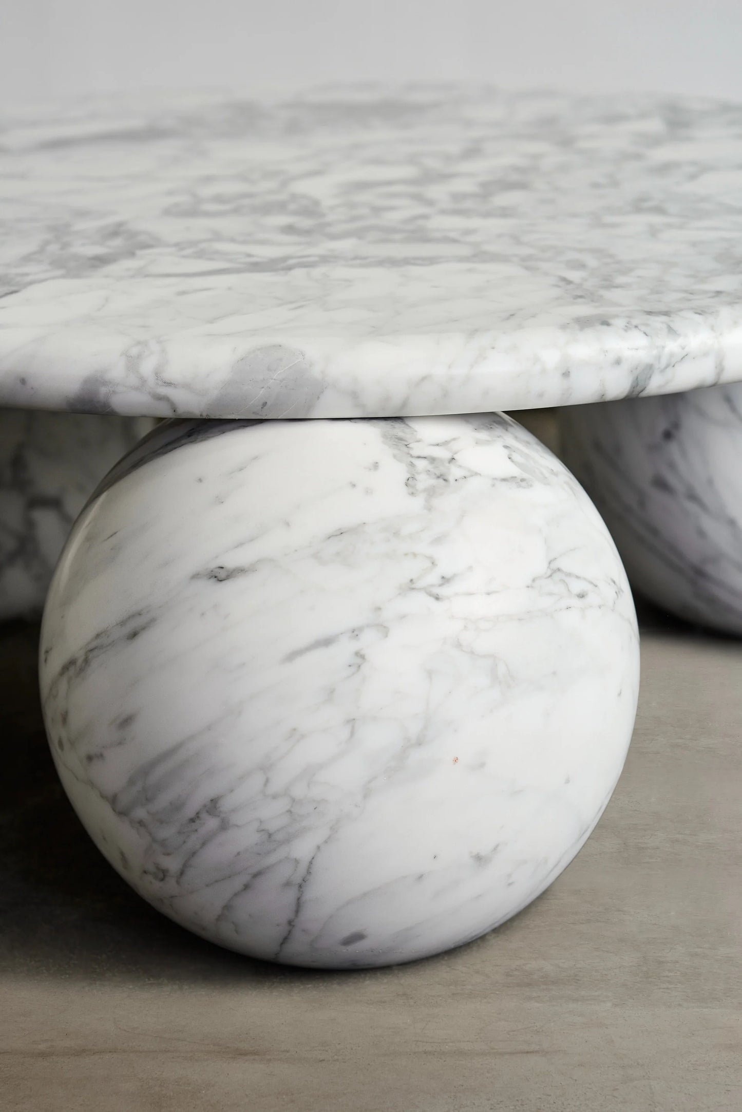 Piccolo white marble coffee table sculptural sphere base detail