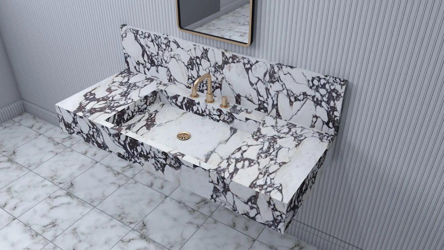 Rome marble sink shown in angled perspective highlighting integrated basin and natural veining