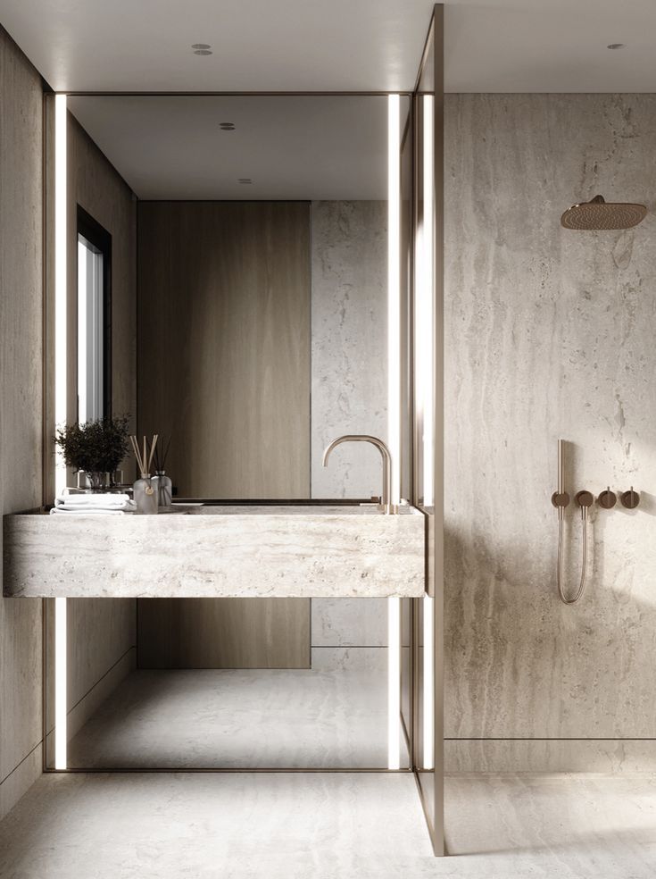 Toscana stone sink in warm travertine bathroom with integrated basin and minimalist wall mounted faucet