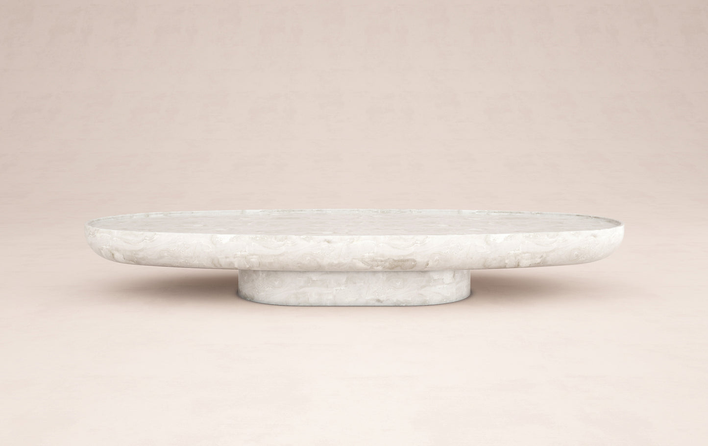 Trento luxury onyx coffee table by Eden Stone Designs with elegant oval silhouette and sculptural natural stone base