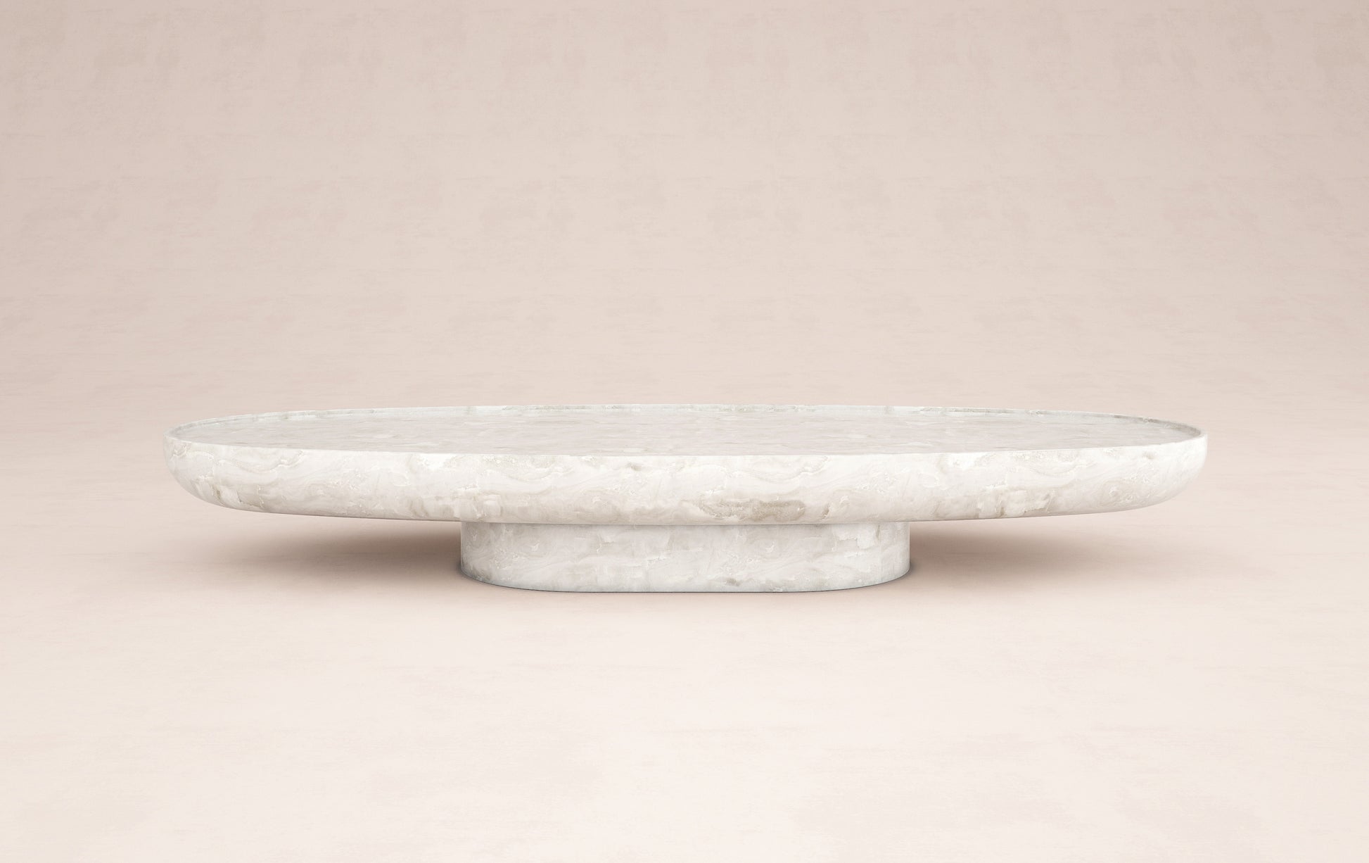 Trento luxury onyx coffee table by Eden Stone Designs with elegant oval silhouette and sculptural natural stone base