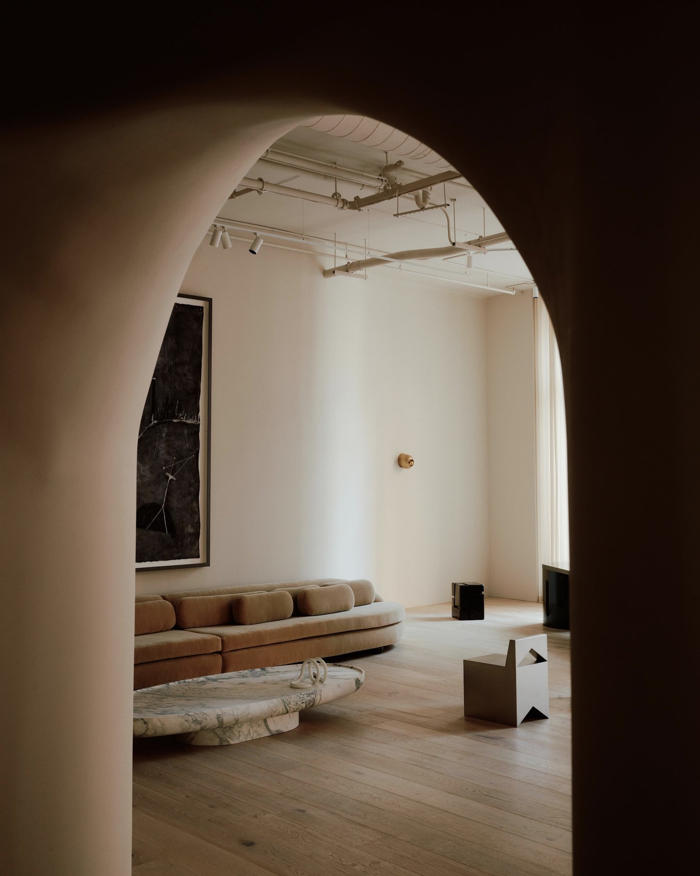 Trento marble coffee table by Eden Stone Designs in a modern living room interior showcasing sculptural stone design