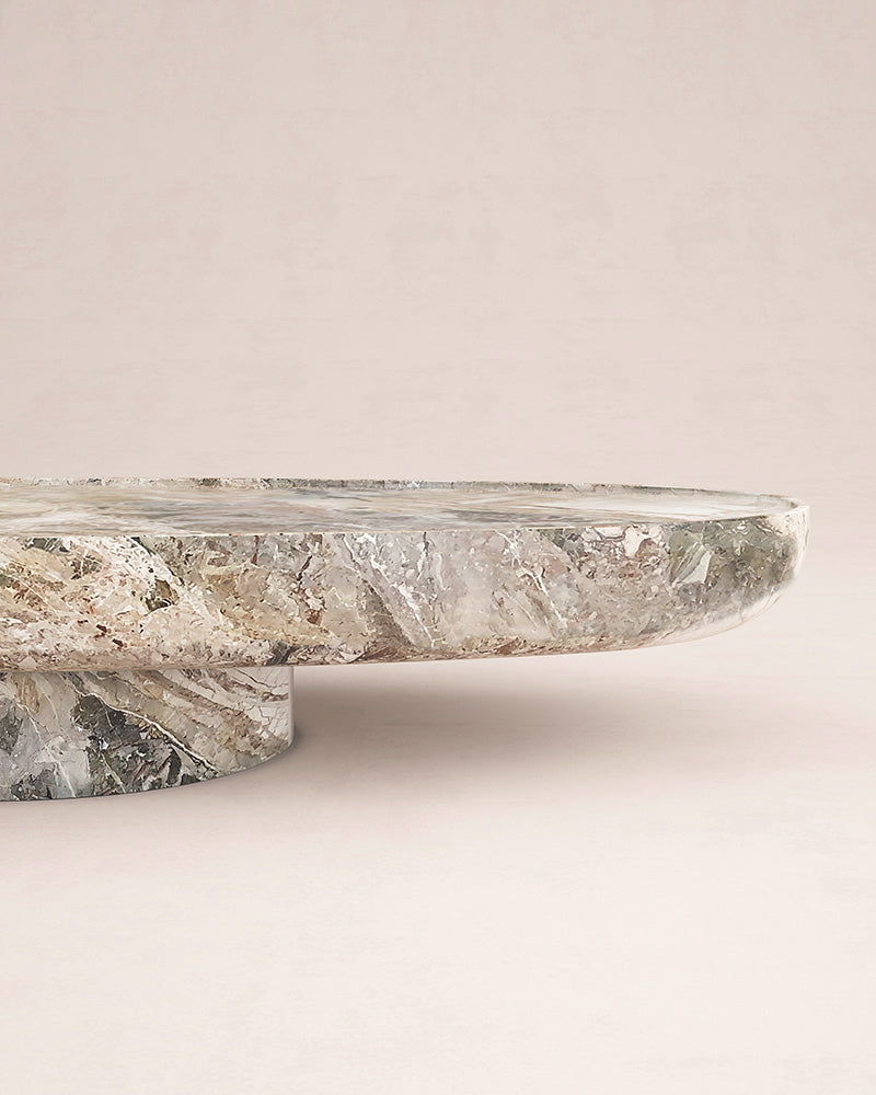 Side view of Trento marble coffee table with sculptural base by Eden Stone Designs