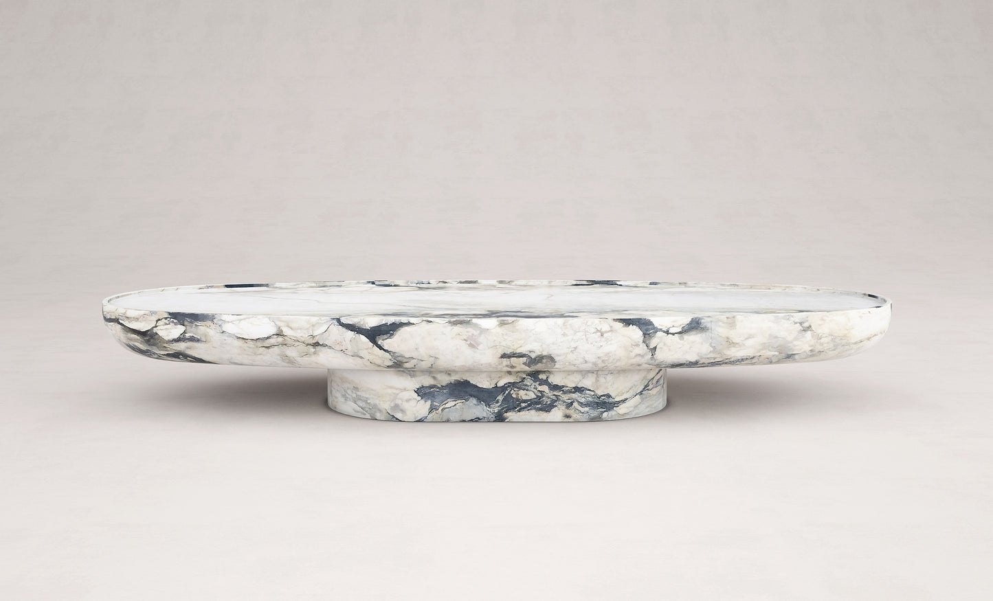Trento oval marble coffee table by Eden Stone Designs showcasing sculptural stone design