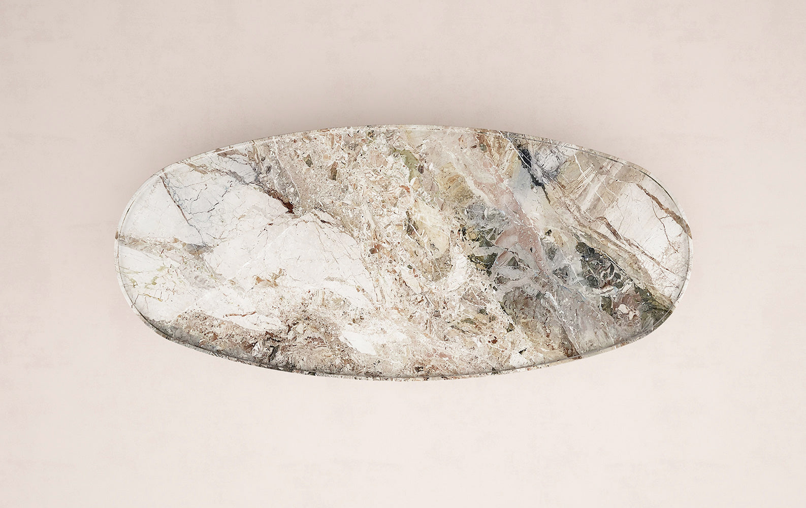 Top view of Trento oval marble coffee table by Eden Stone Designs showing natural stone pattern