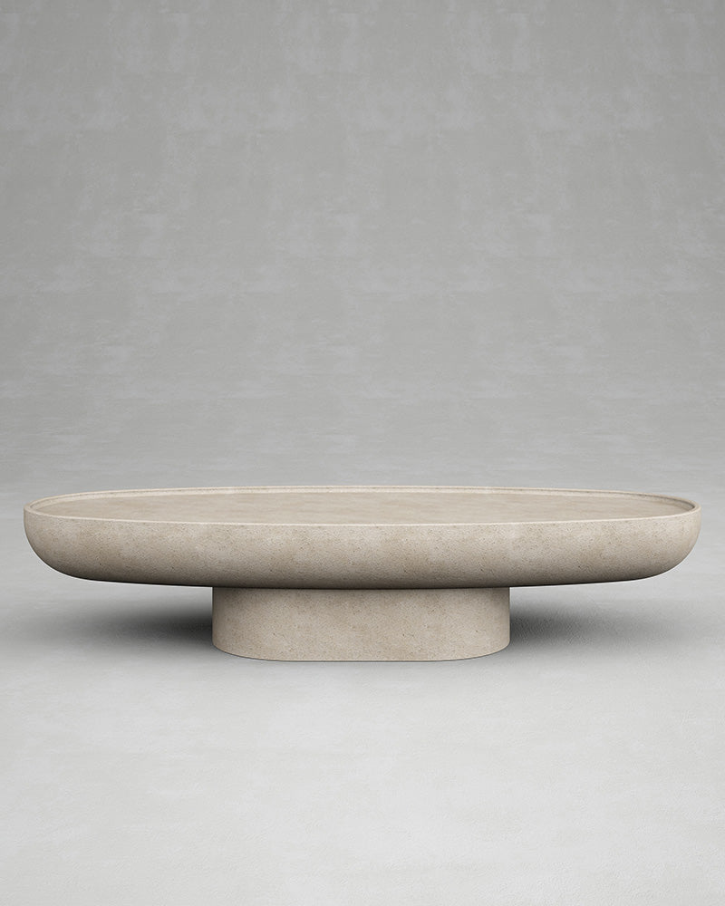 Trento oval stone coffee table by Eden Stone Designs with sculptural monolithic base