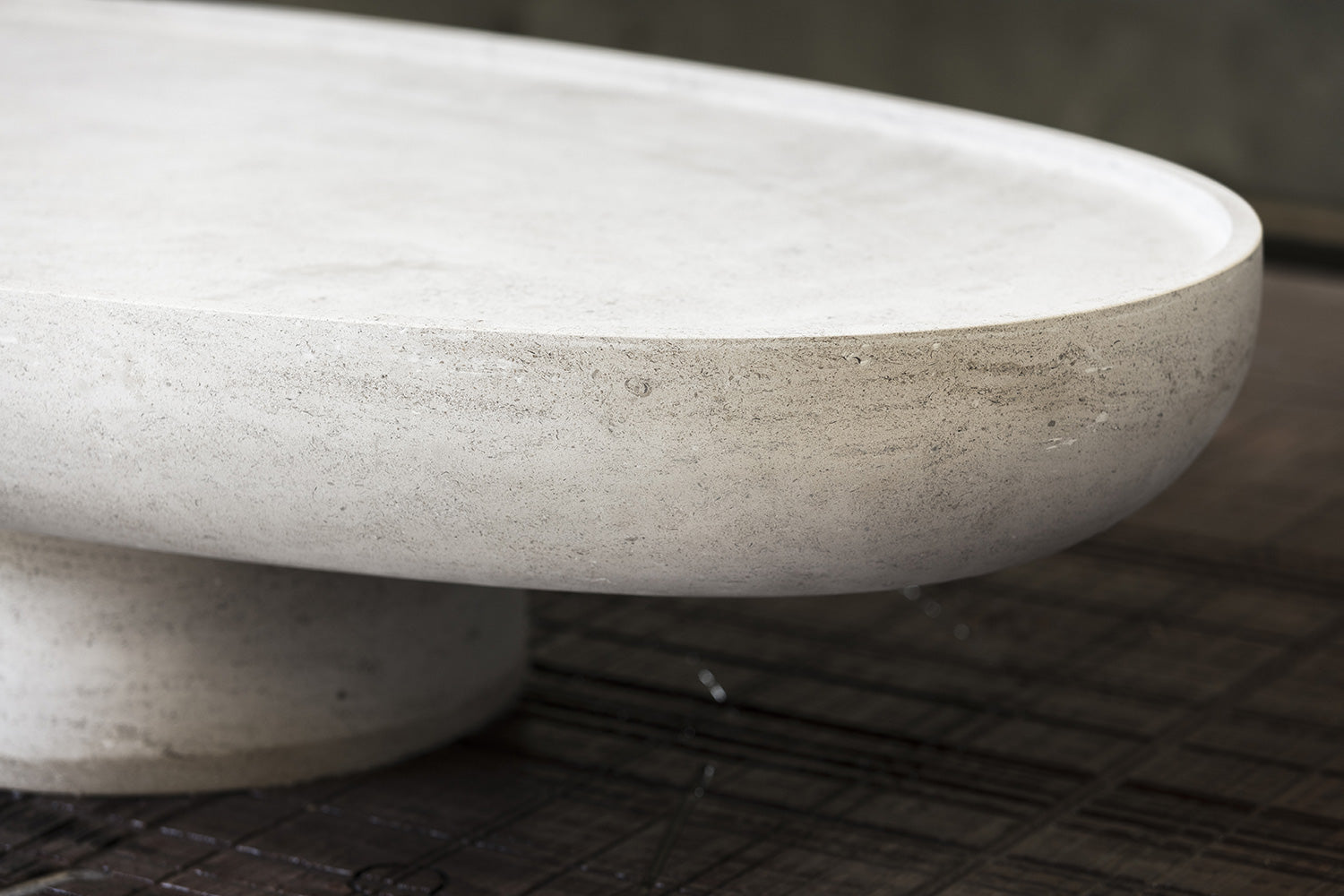 Detail of the Trento stone coffee table edge by Eden Stone Designs highlighting handcrafted stone finish