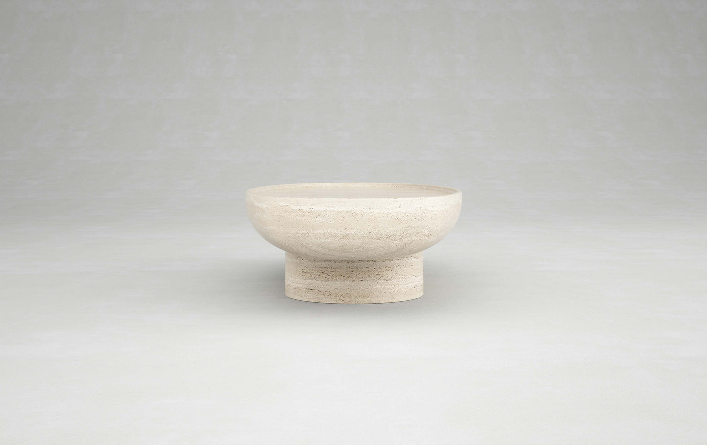 Trento travertine coffee table pedestal base by Eden Stone Designs highlighting sculptural stone design