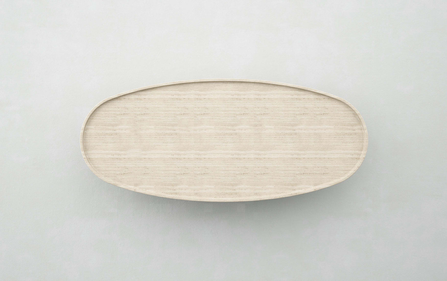 Top view of the Trento travertine oval coffee table by Eden Stone Designs highlighting natural stone surface and minimalist design