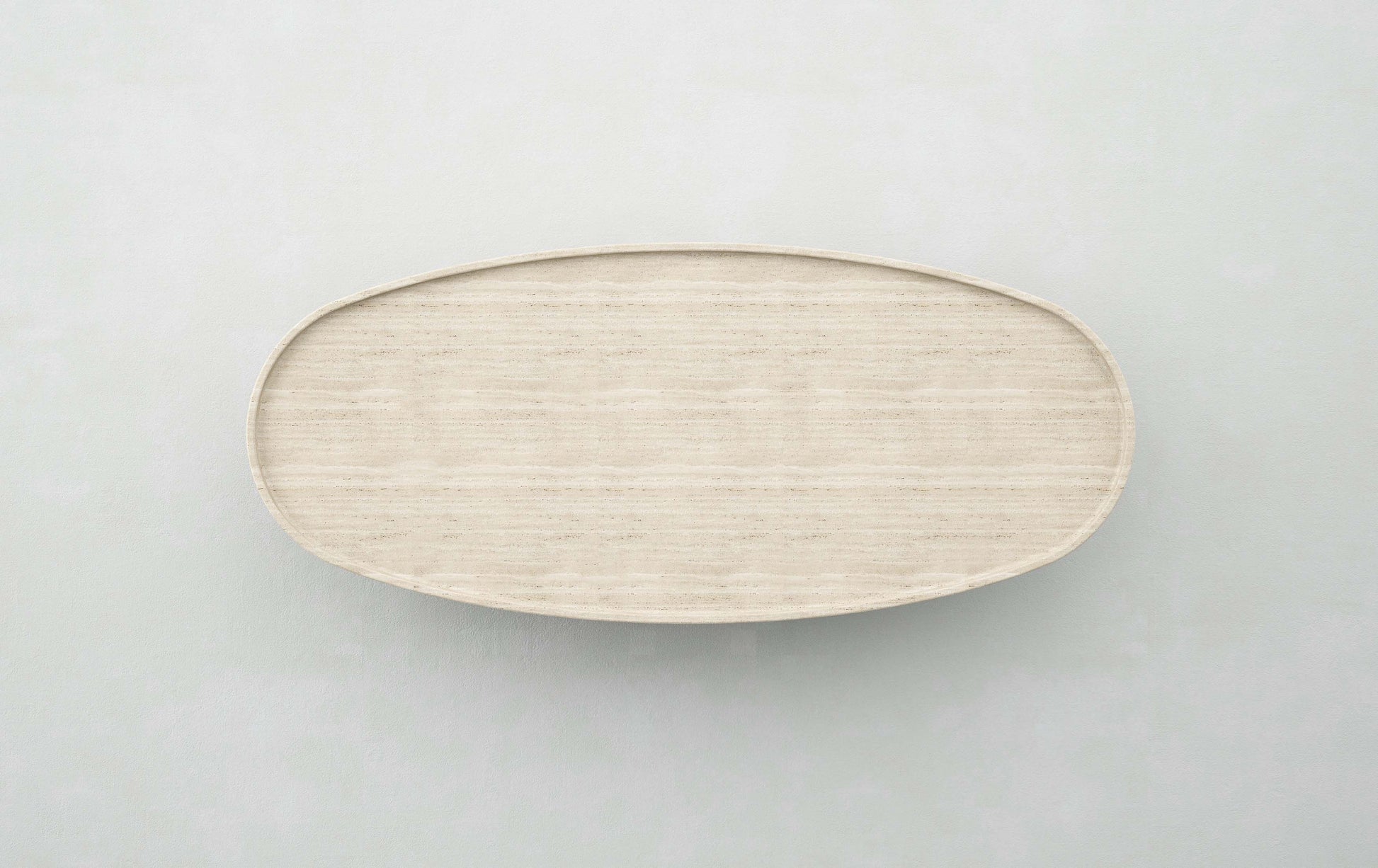 Top view of the Trento travertine oval coffee table by Eden Stone Designs highlighting natural stone surface and minimalist design